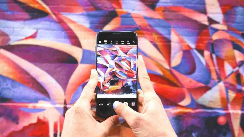 Mobile being used to capture graffiti