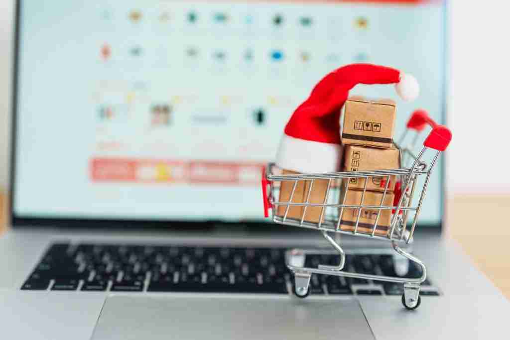 Christmas Online Shopping concept. Boxes with shopping cart