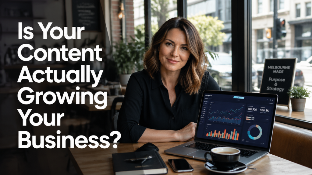 Australian small business owner reviewing social media content strategy on laptop in modern café workspace