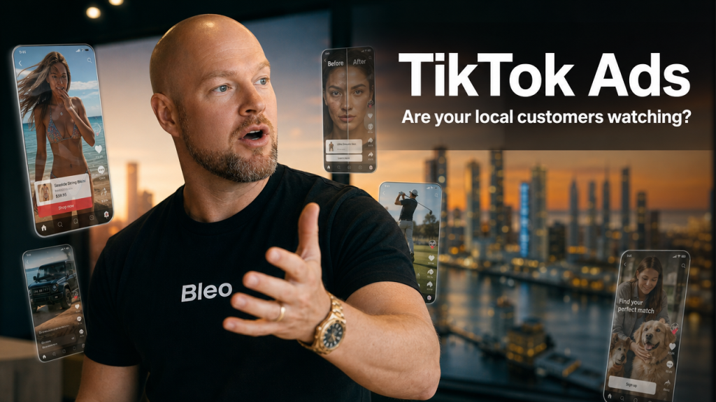 Luke Houlihan explaining TikTok Ads strategy for Gold Coast small businesses with holographic video screens in background