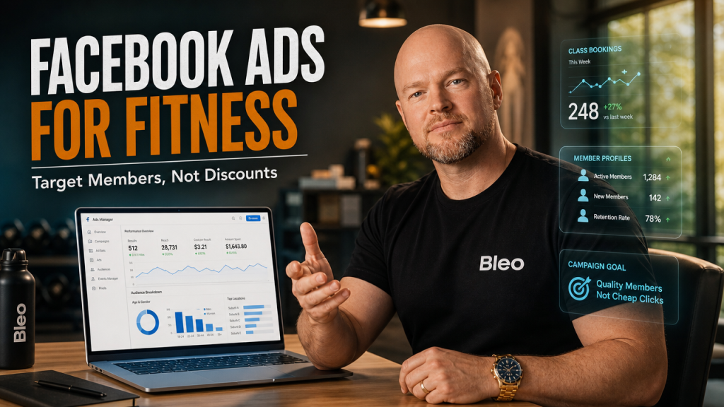 Luke Houlihan at a modern fitness studio desk reviewing Facebook Ads Manager interface, displaying member targeting data and class bookings, with a confident smile and holographic marketing visualizations around him.