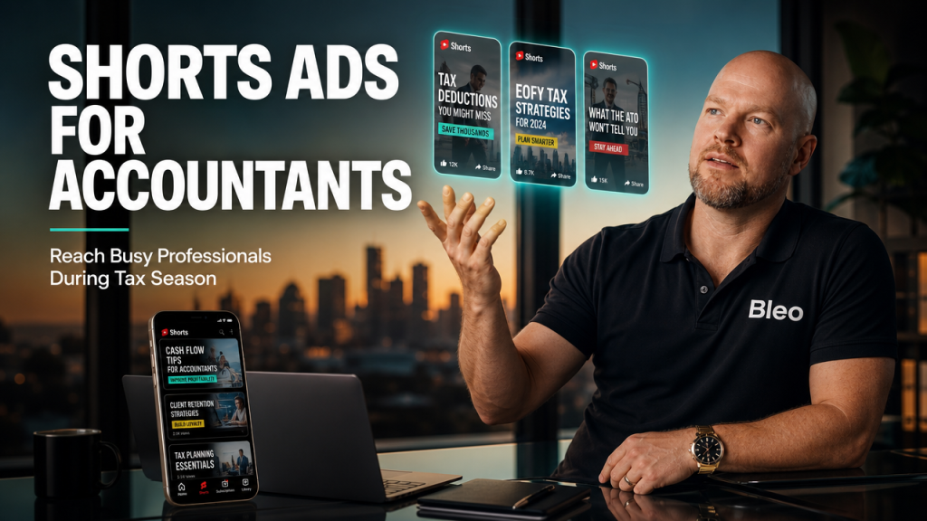 Luke Houlihan gestures confidently while explaining YouTube Shorts ads strategy for accountants, with holographic video tiles and a smartphone displaying Shorts interface in a premium office setting overlooking the city